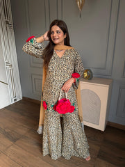 Beautiful leopard print with 3D flower embroidery paired with kaildaar sharara and net dupatta (Karina)