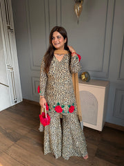 Beautiful leopard print with 3D flower embroidery paired with kaildaar sharara and net dupatta (Karina)