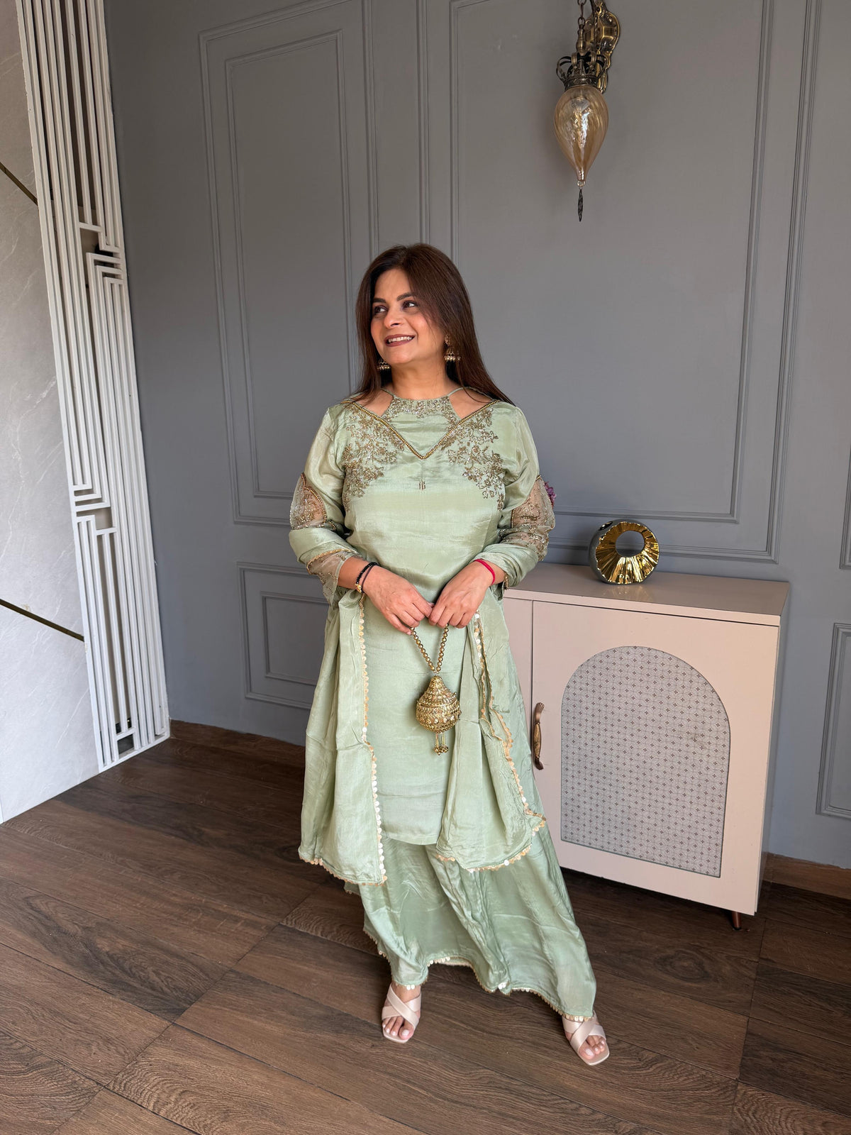Beautiful hand embroidered sharara chinnon suit